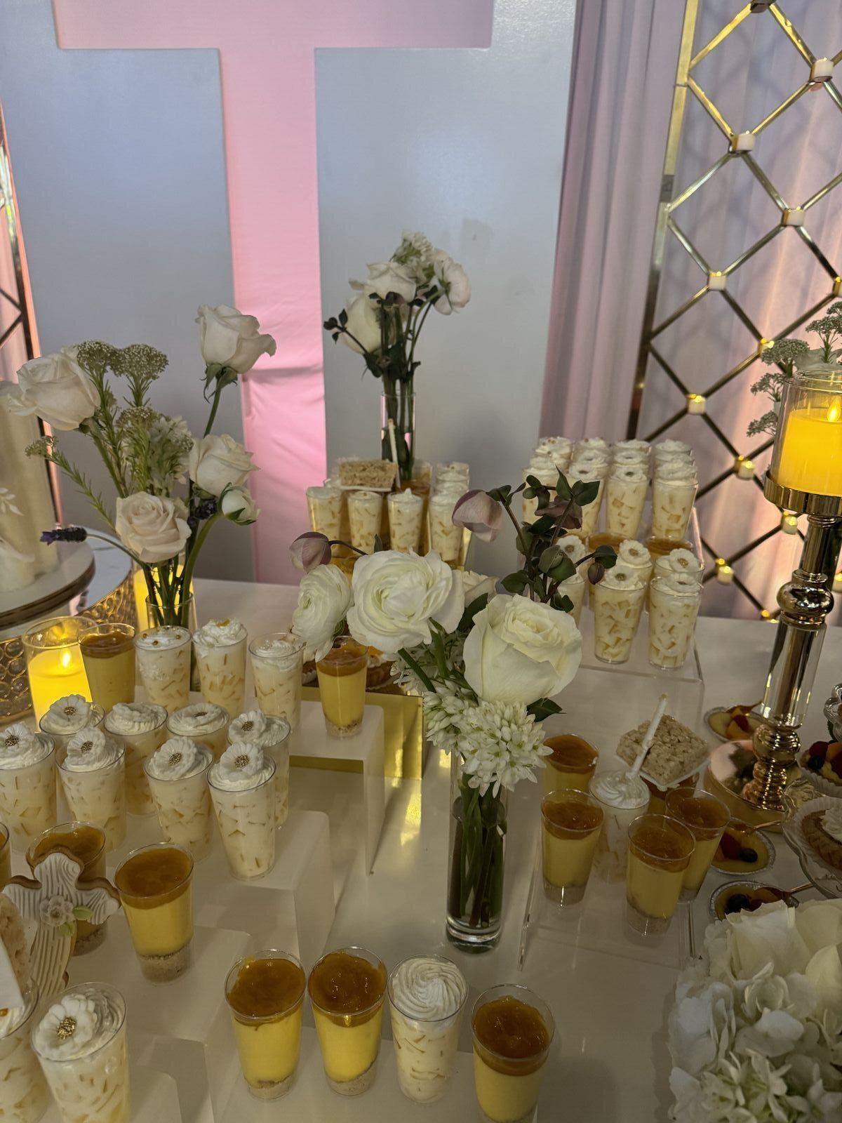 Elegant baptism dessert table with white and gold decor