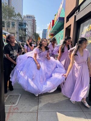 Quinceañera bridal party arriving in lavender ball gowns outside The Prestige Venue