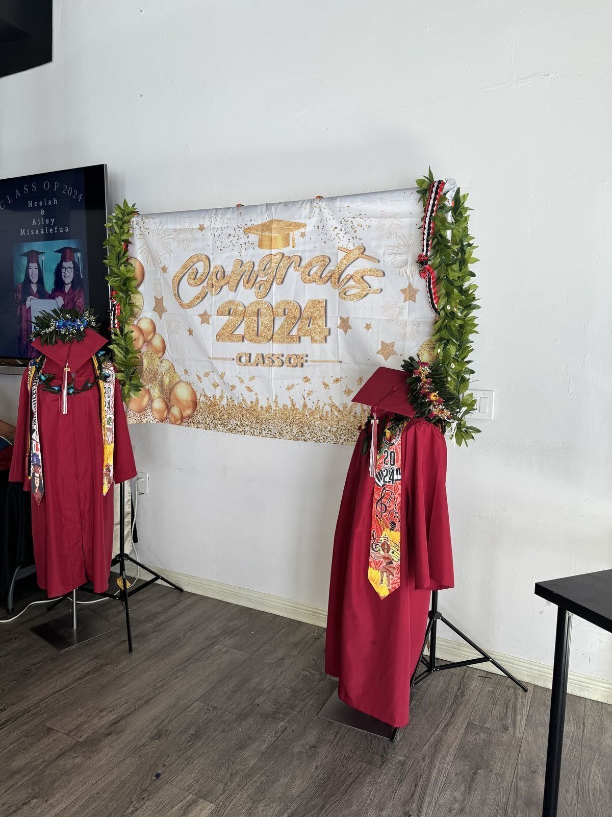 Graduation party with congratulations backdrop and decorations