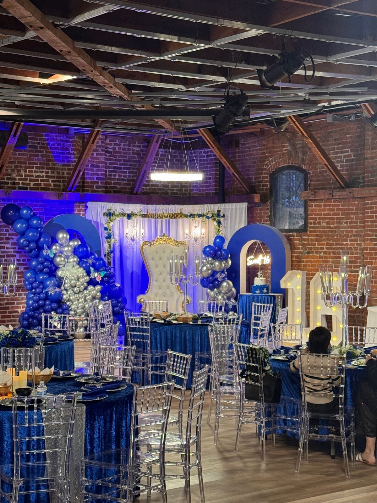 The Prestige Hall interior showcasing exposed brick and soaring ceilings
