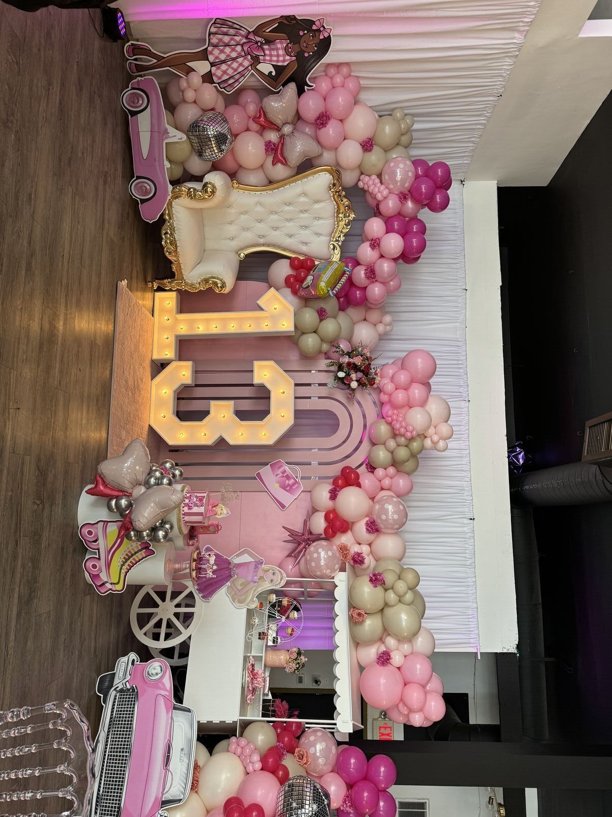 Quinceañera venue setup at The Prestige Hall with purple and gold theme