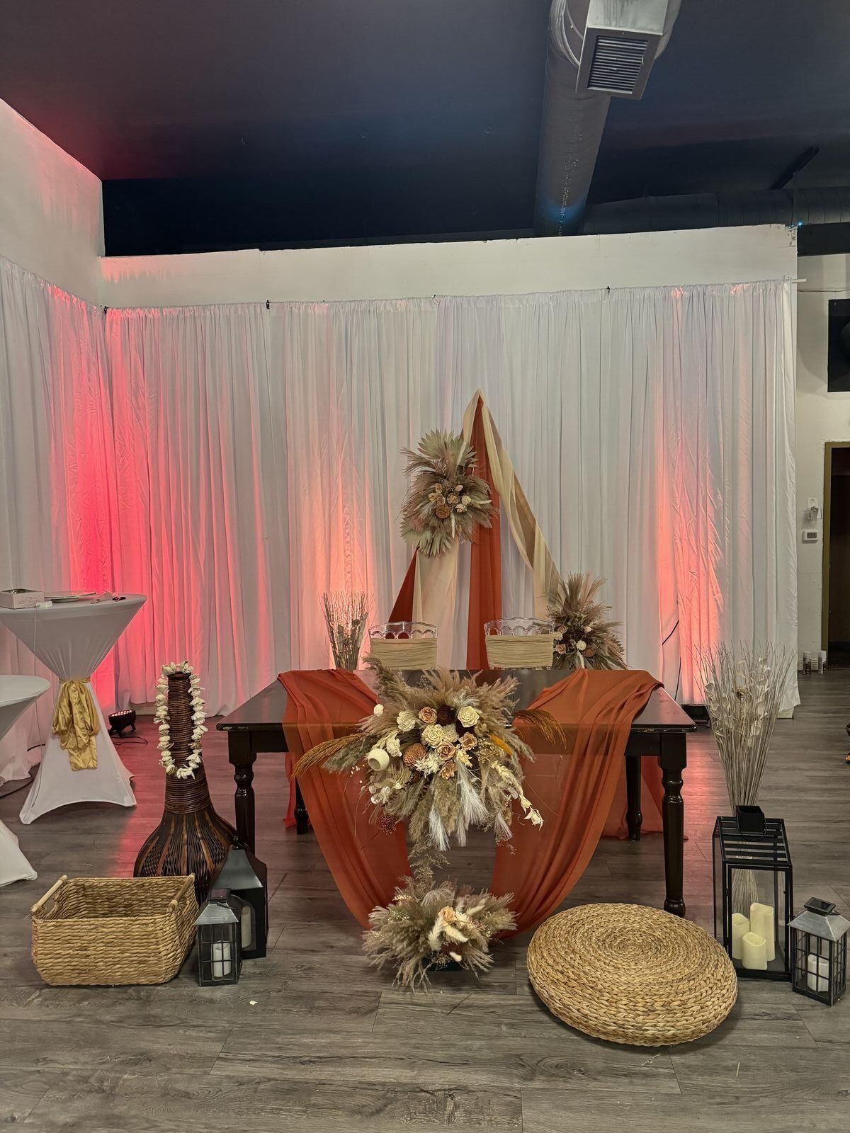 Rustic boho wedding setup with terracotta and pampas grass decor